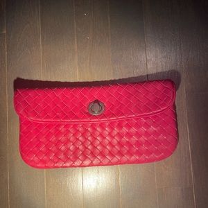 Woven leather turn-lock clutch